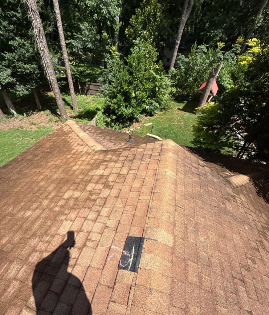 Older shingle roof inspected for a leak on a Chamblee, GA home