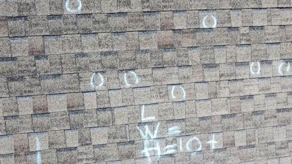 Hail damage test square marked during a roof inspection in Marietta, GA