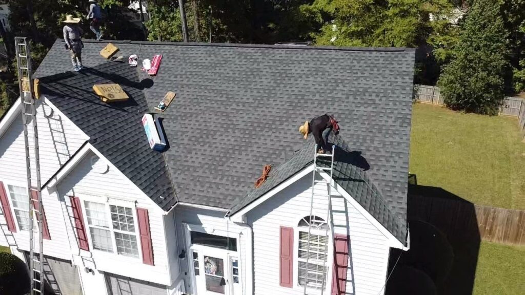 Drone view of an Emergency Roofing Solutions crew replacing a roof in Hampton, GA