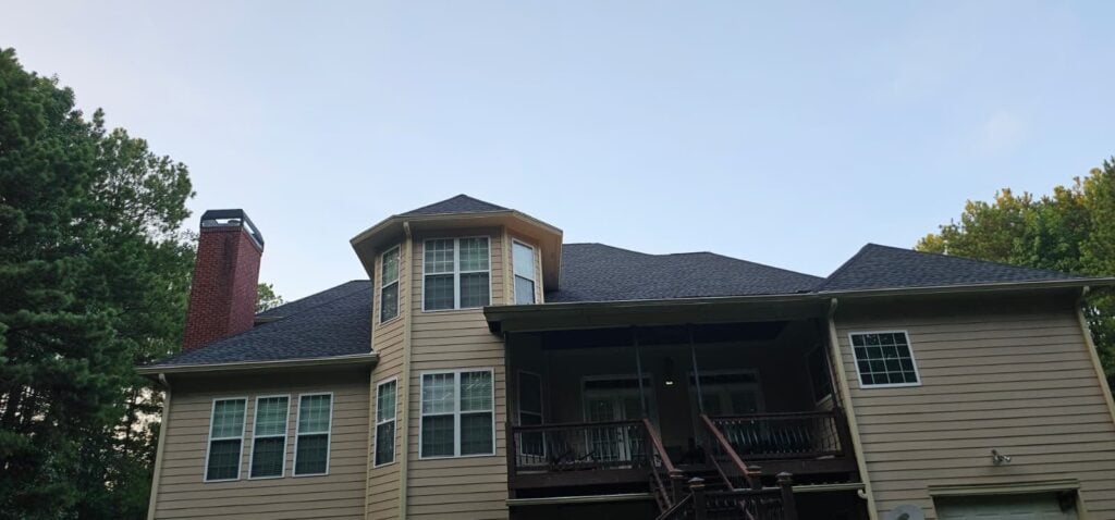 Hoschton, GA home with a new shingle roof by Emergency Roofing Solutions
